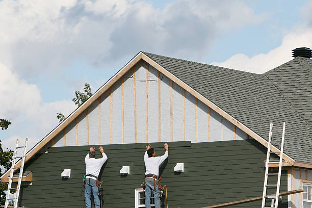 Professional Storm Damage Siding Repair technician working in Penrose, NC